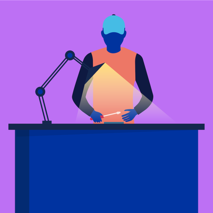 Asentaja korjaa puhelinta korjauskeskuksessa